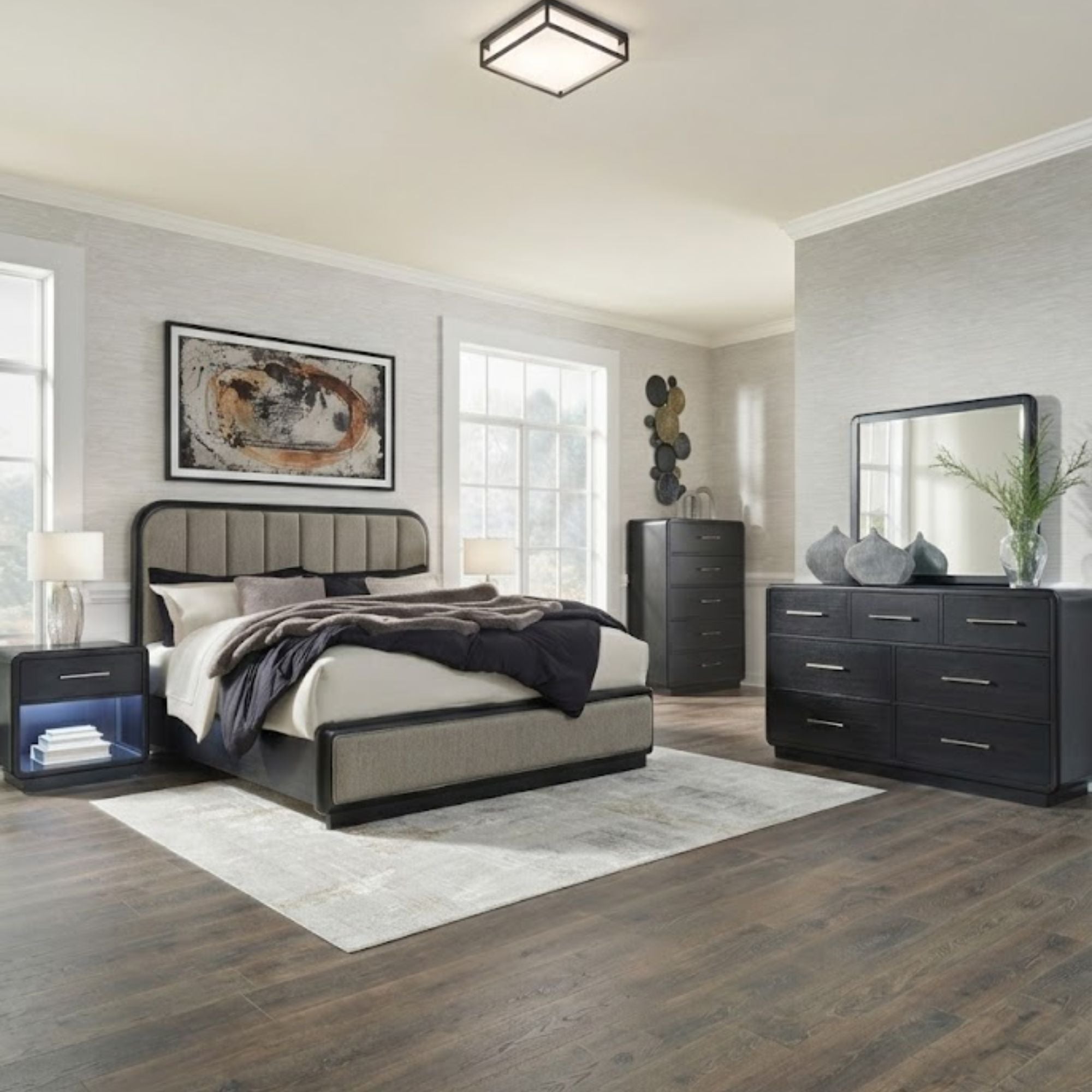 Ashley Rowanbeck upholstered panel bedroom set with a bed, nightstands, and matching furniture in a modern design.