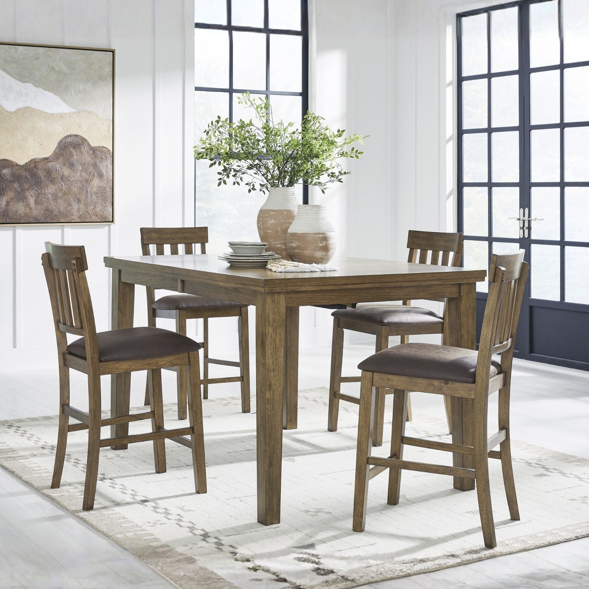 Light brown Ashley Urbinforte 5-piece counter height dining set with table and four matching chairs.