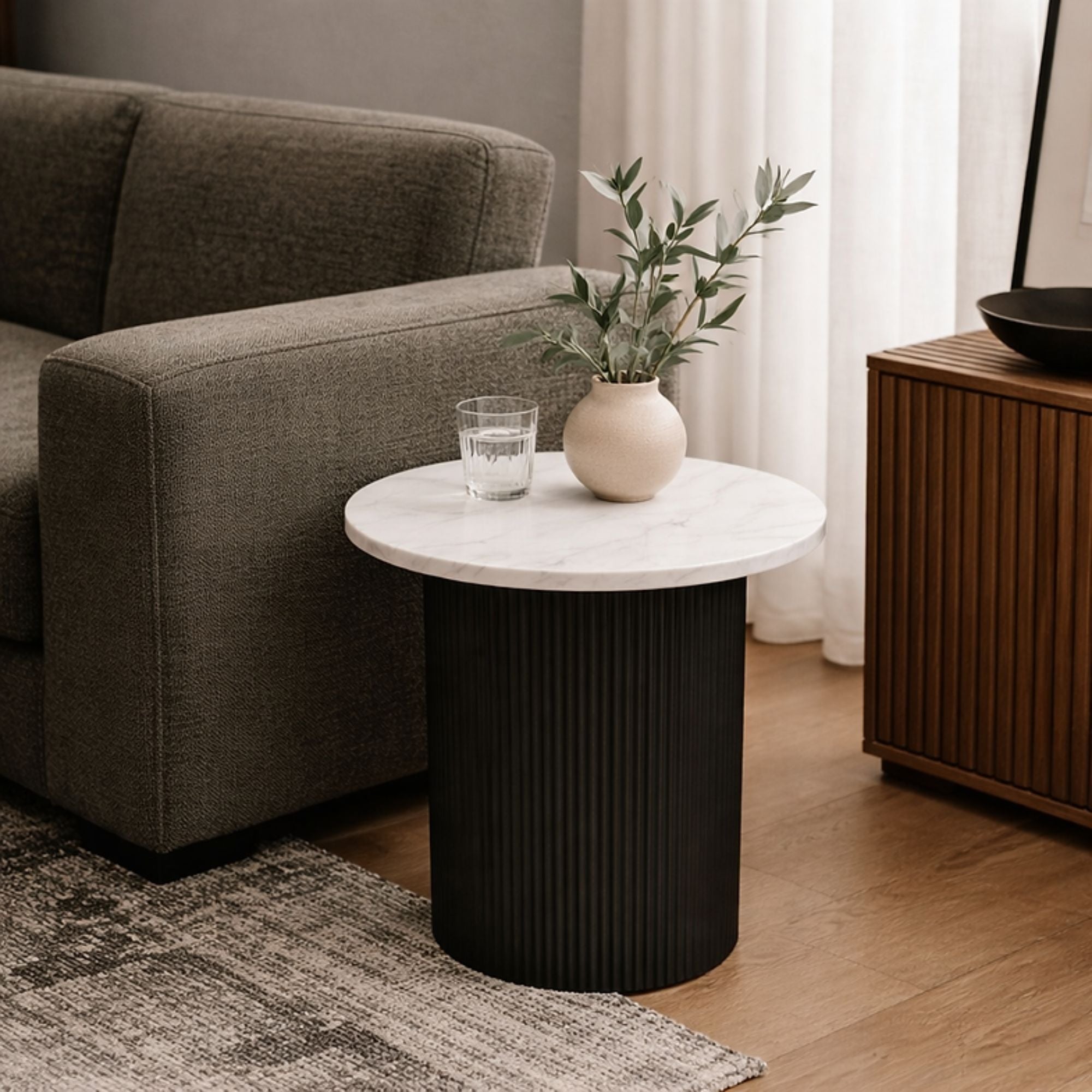 Roman white marble end table with black metal base, modern design by Elite Living, showcasing a sleek, elegant accent piece for living space.
