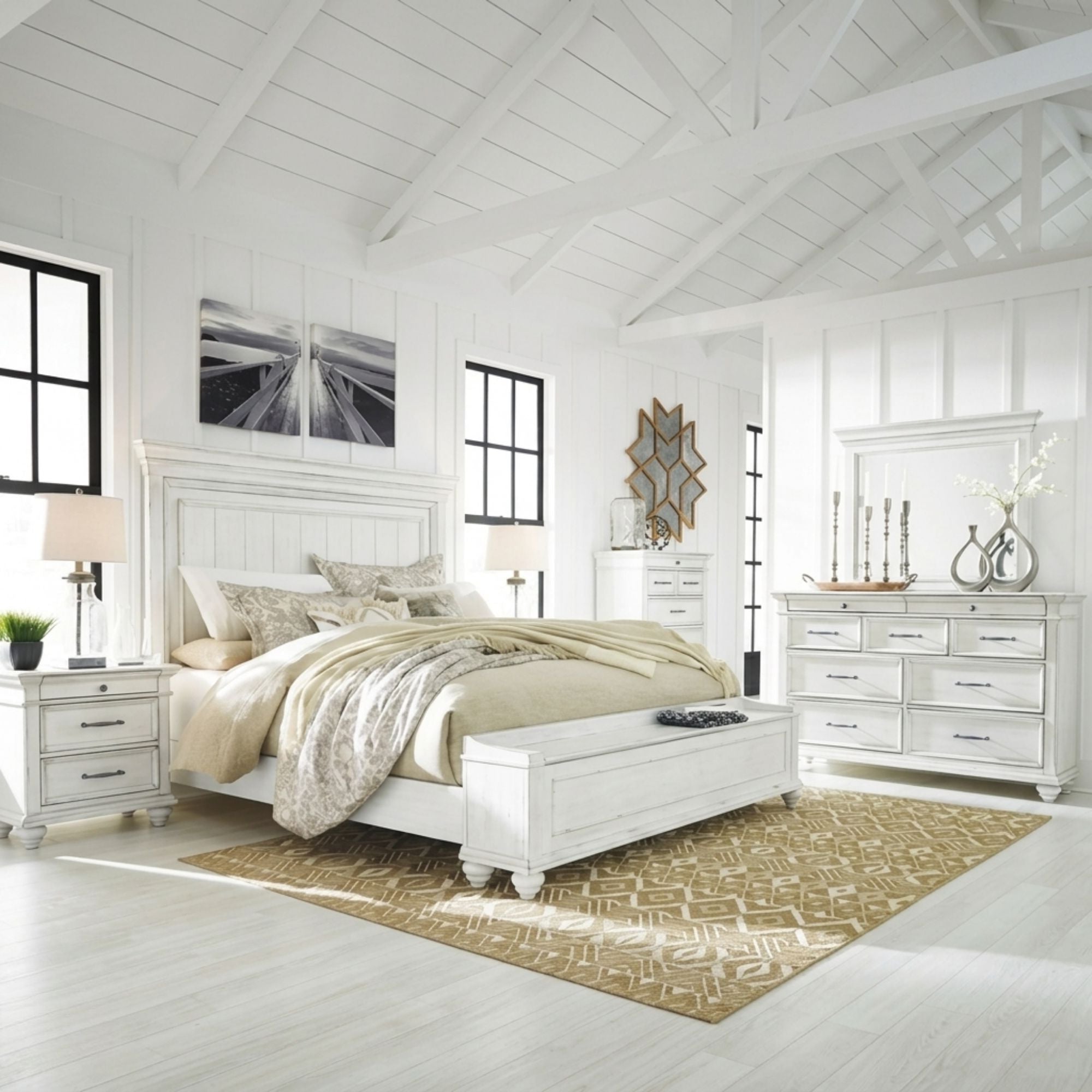 White Kanwyn bedroom set with storage bench by Signature Ashley, showing bed frame, matching dresser, and coordinated bedroom furniture.