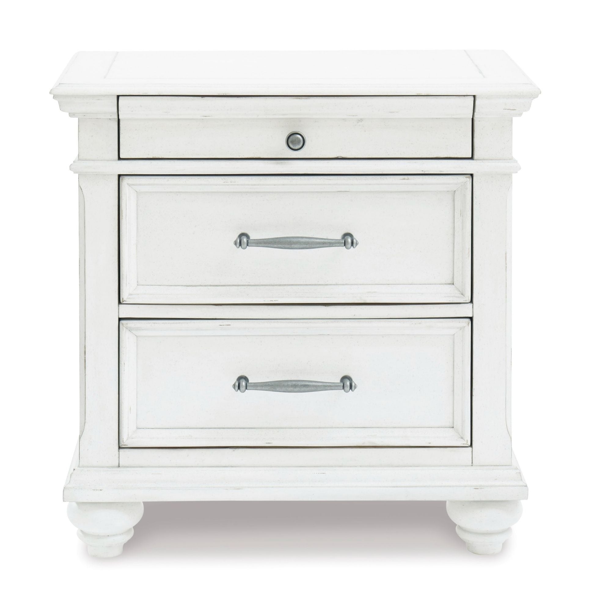 Signature Ashley Kanwyn three-drawer nightstand with wood finish, featuring sleek handles and a modern bedroom decor setting.