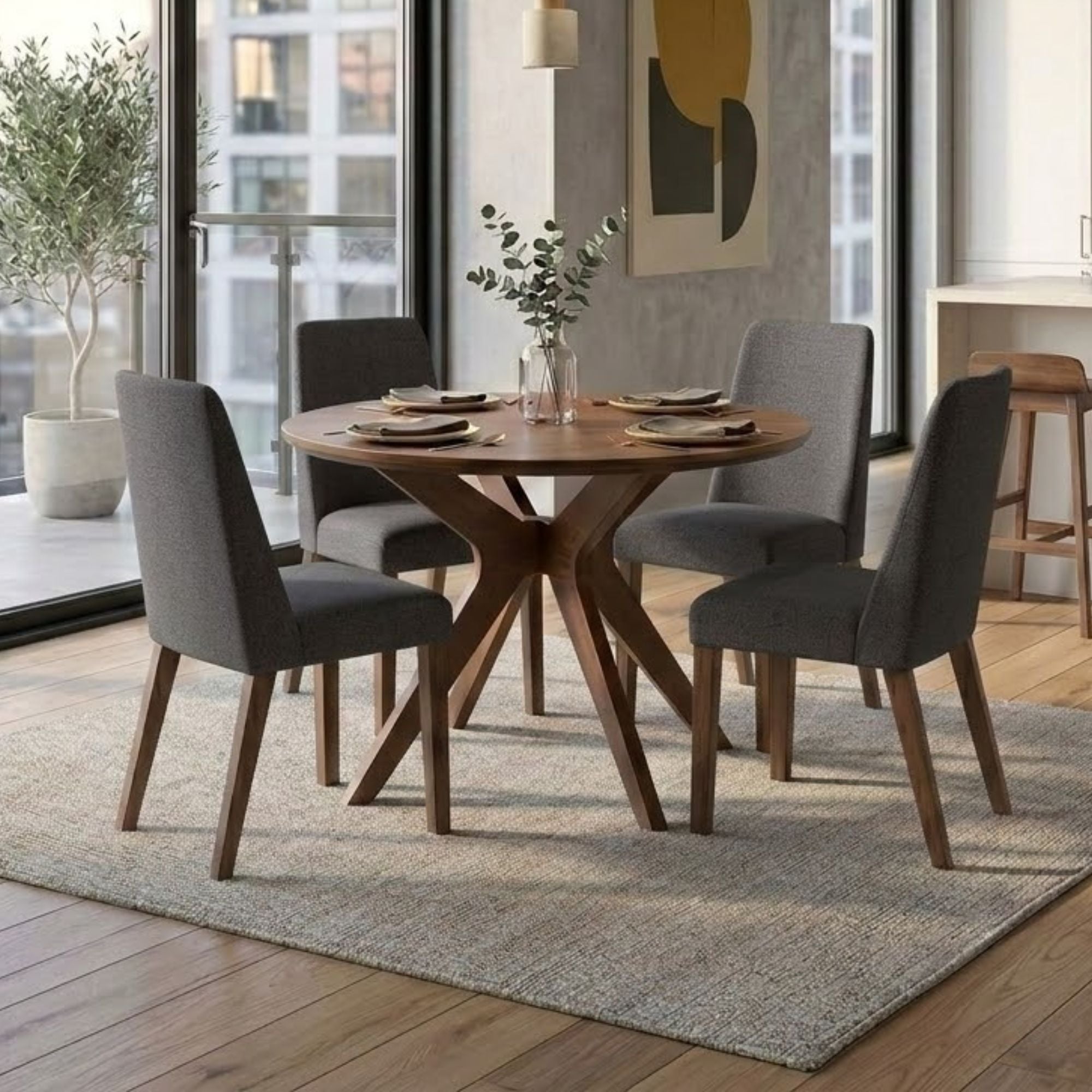 Round charcoal Lyncott Collection dining table set by Signature Ashley with matching chairs in a modern dining room.