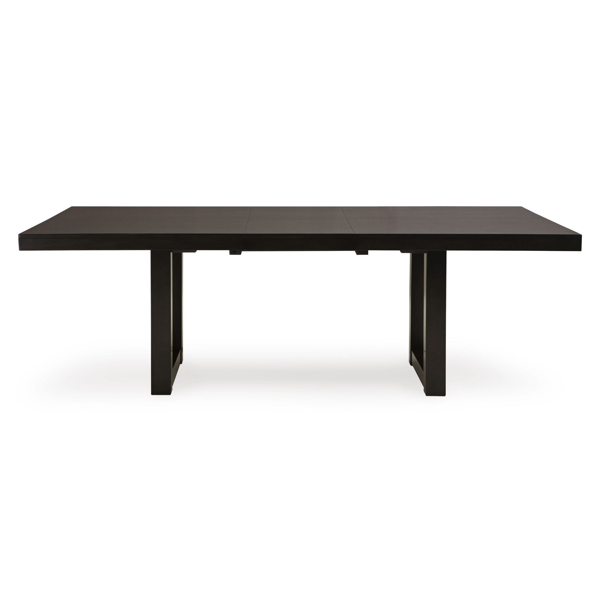 Neymorton dining extension table by Signature Ashley, showcasing a spacious wooden dining table with extension leaves in a modern dining room setting.