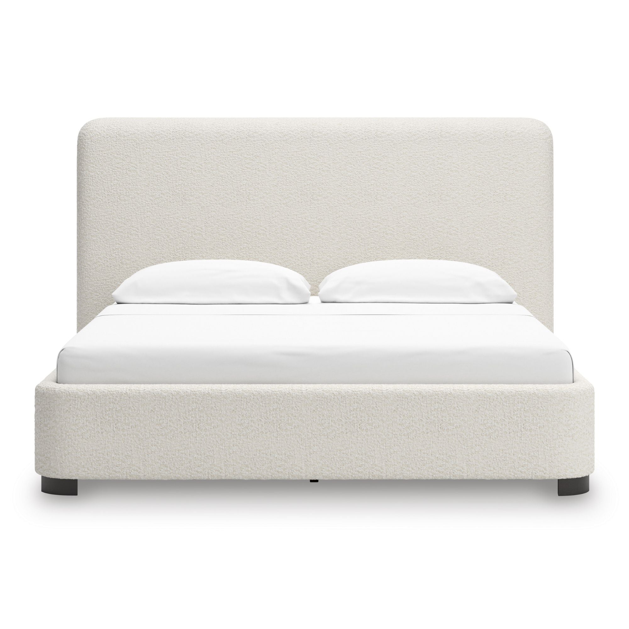 Signature Ashley Brintstreet upholstered wing bed with padded headboard and tufted design, shown in a stylish bedroom setting.