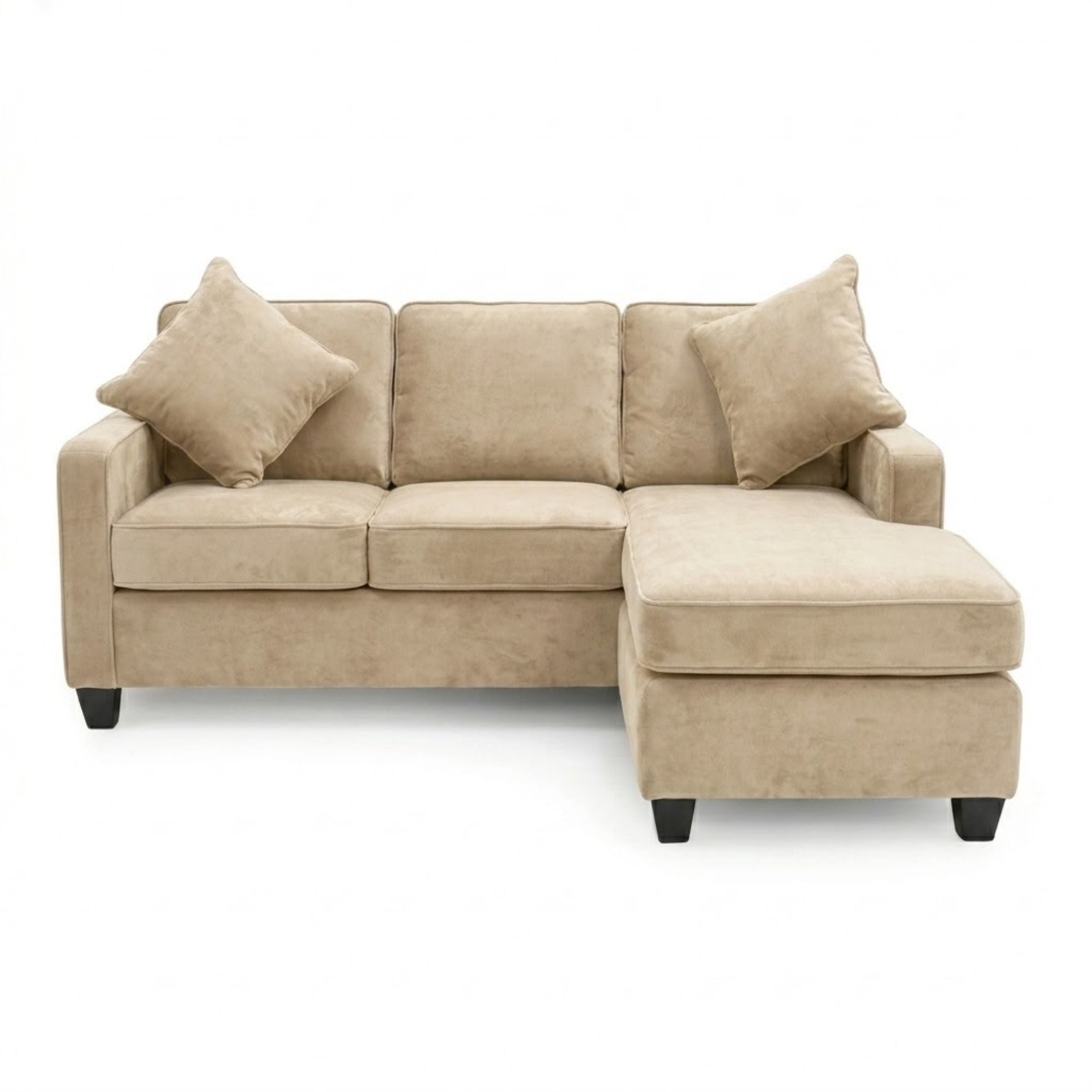 A beige Canadian-made reversible sectional sofa with chaise and matching ottoman, featuring modern design and plush cushions.