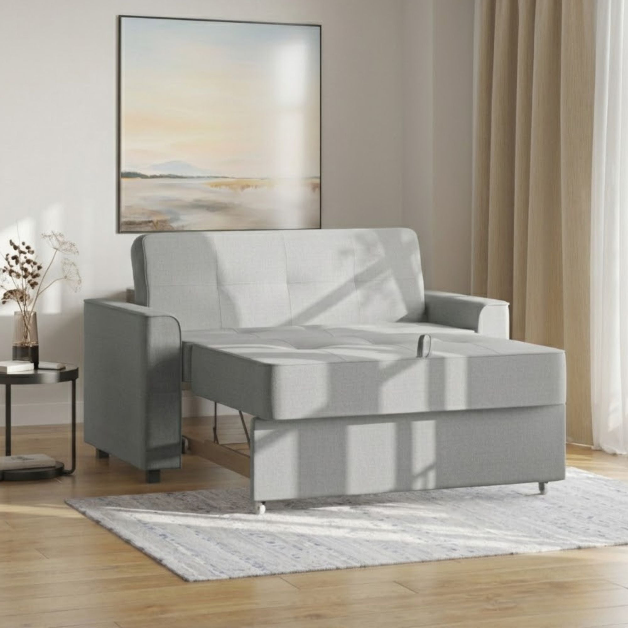 Grey Canadian-made Titus Furniture sofa sleeper with folded mattress and modern design, perfect for seating and sleeping.