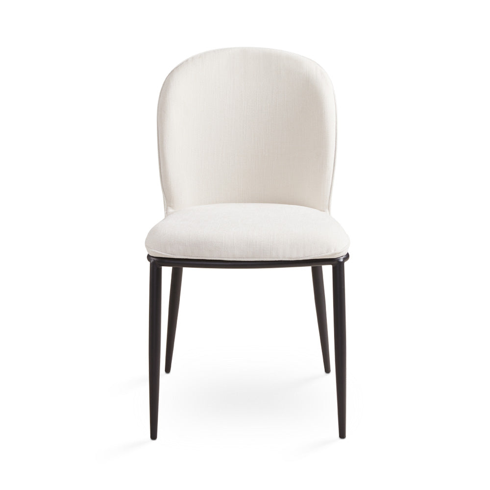Set of two Xcella Angie Ivory Silex dining chairs with wooden legs, shown with dining table and natural wood finish.