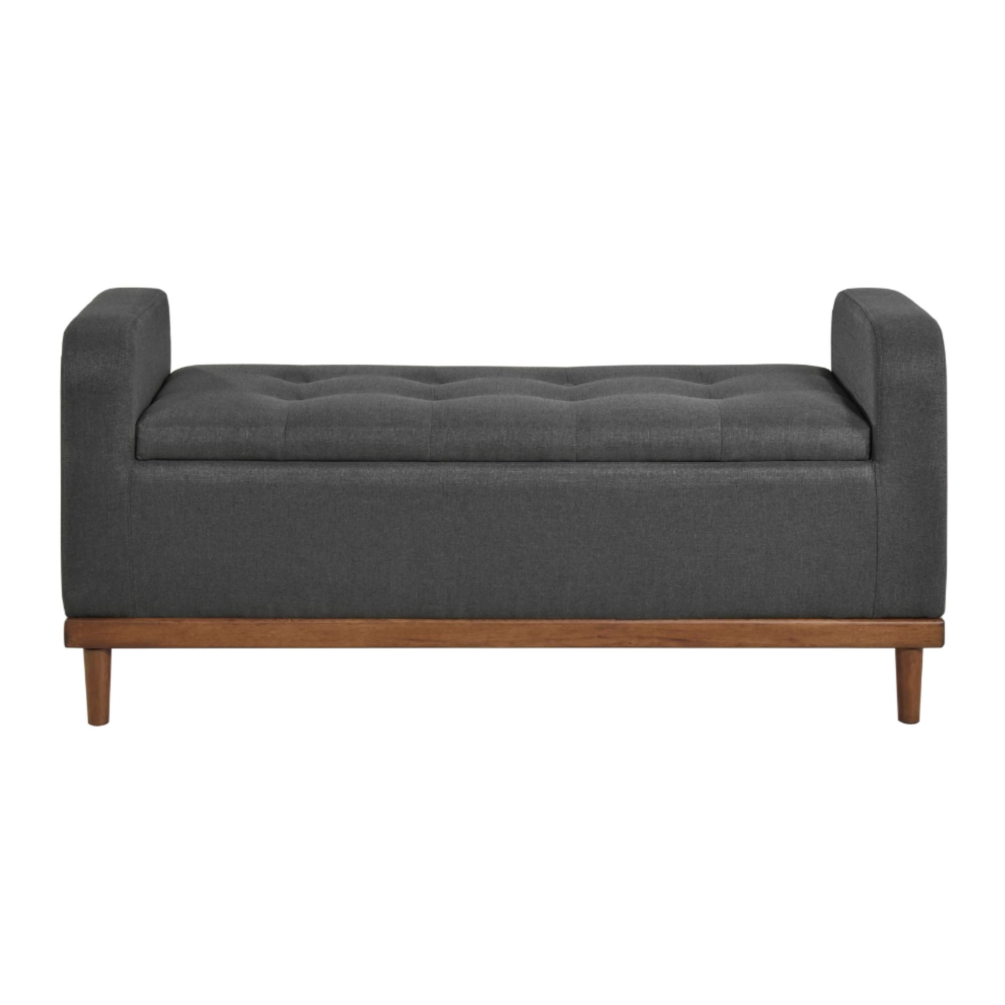 Dark grey MAZ Brigitte Collection lift top storage ottoman with fabric upholstery and spacious interior for versatile storage.