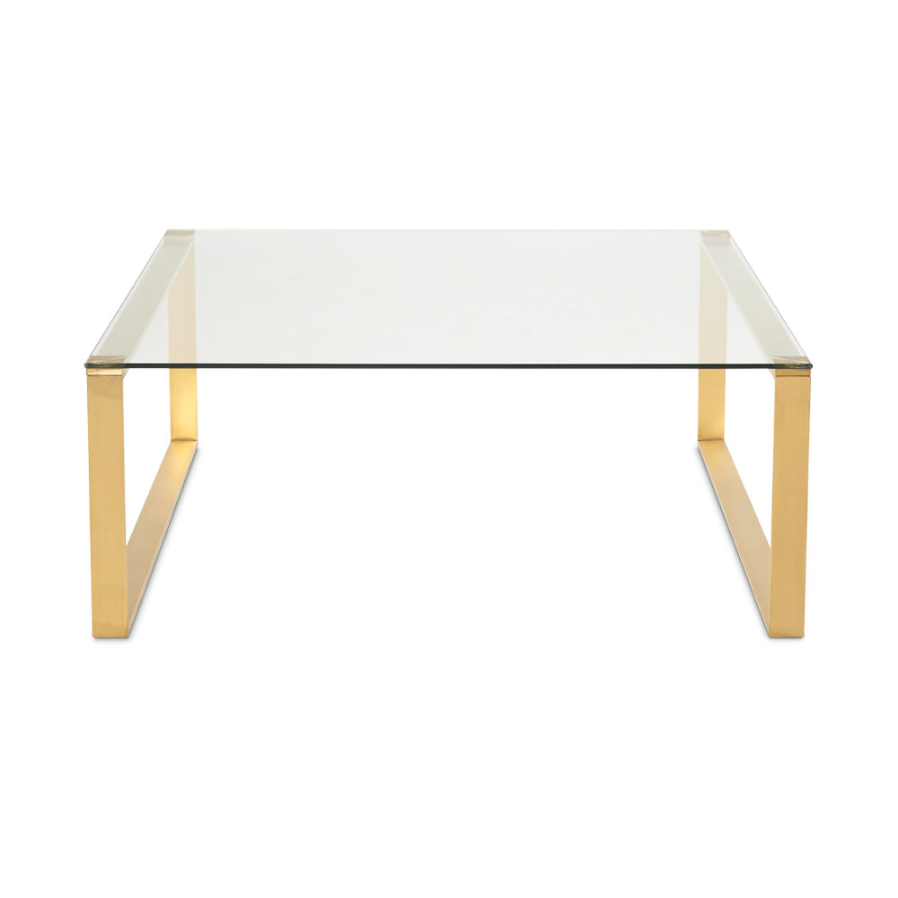 Square brushed gold coffee table from Xcella with a modern design, featuring a sleek and stylish look.
