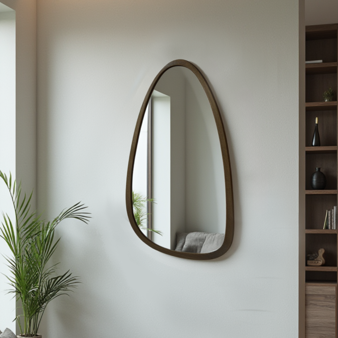 Xcella Thelma wall mirror with a sleek frame, reflecting a modern interior with natural light and minimalist decor.
