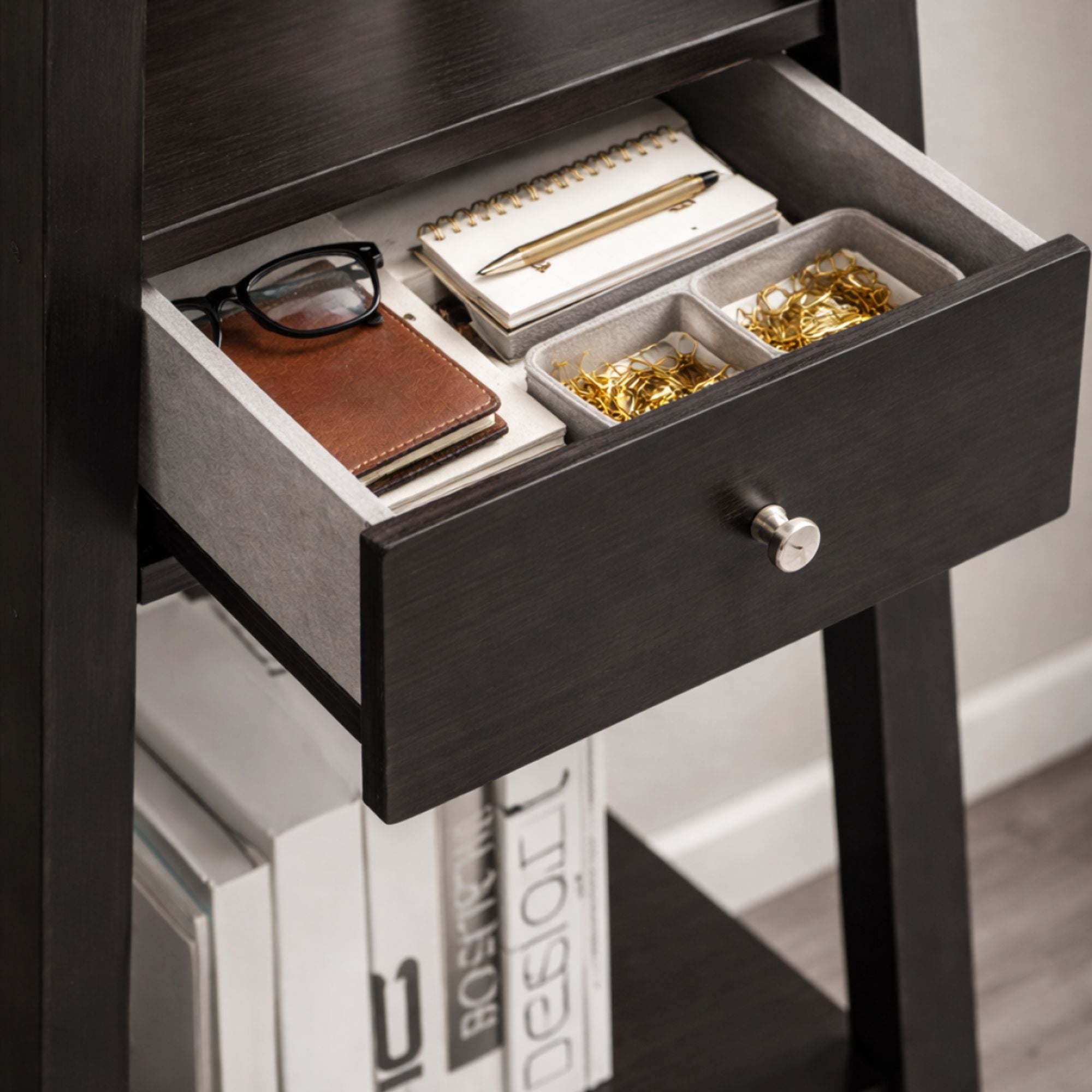 Modern Brassex ladder display bookcase with open shelves and a built-in drawer for stylish storage and organization.