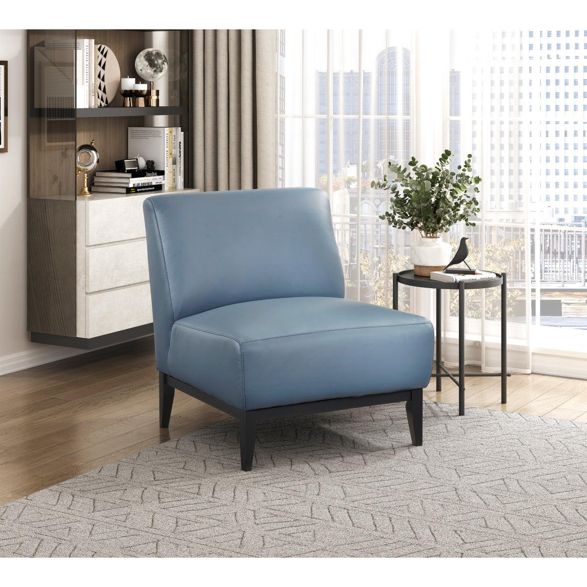 Light blue leather Houghton Slipper Chair by MAZ, an elegant accent chair with a sleek, modern design and plush upholstery.