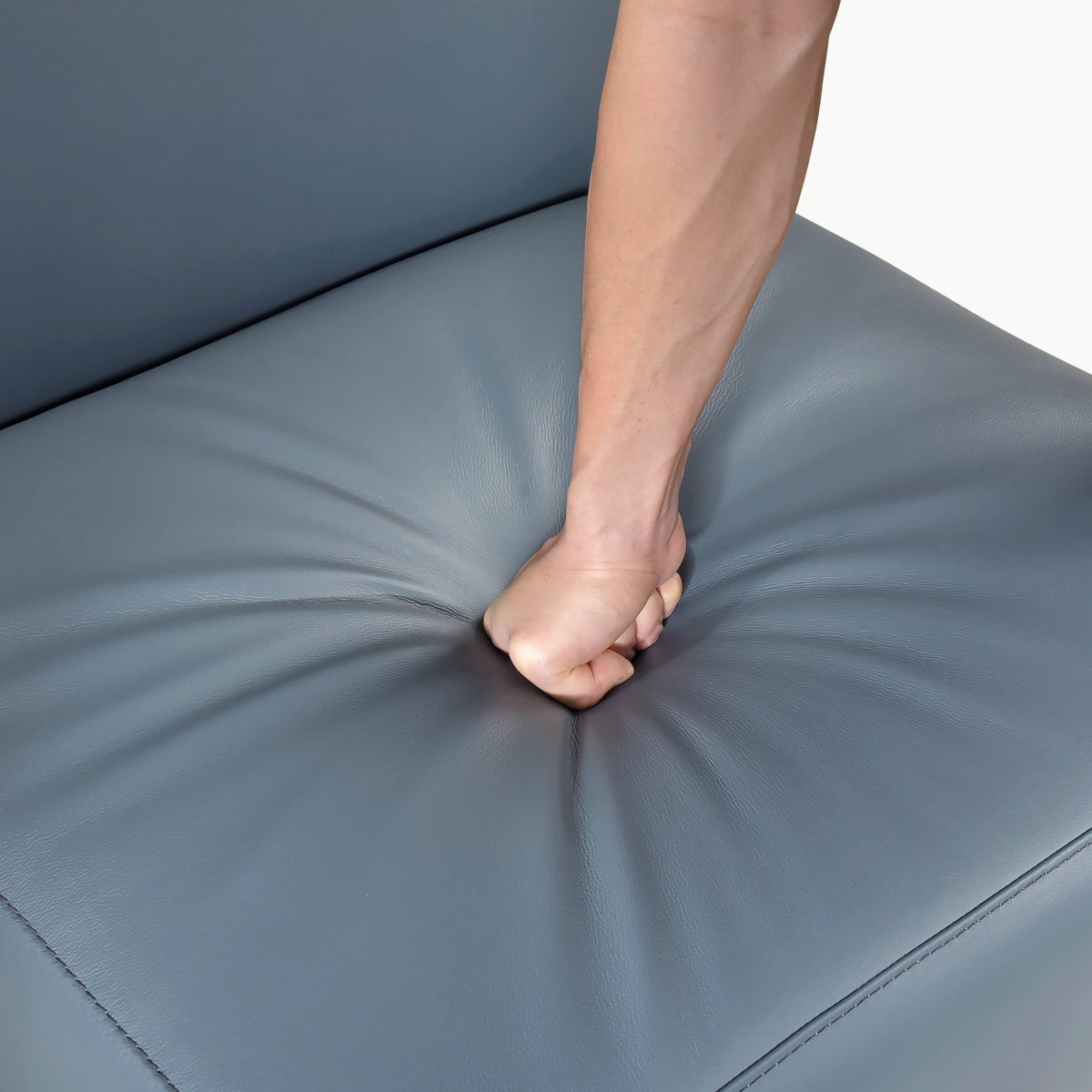 Close-up of MAZ Houghton Leather Accent Chair in light blue, showcasing soft leather upholstery and elegant design details.