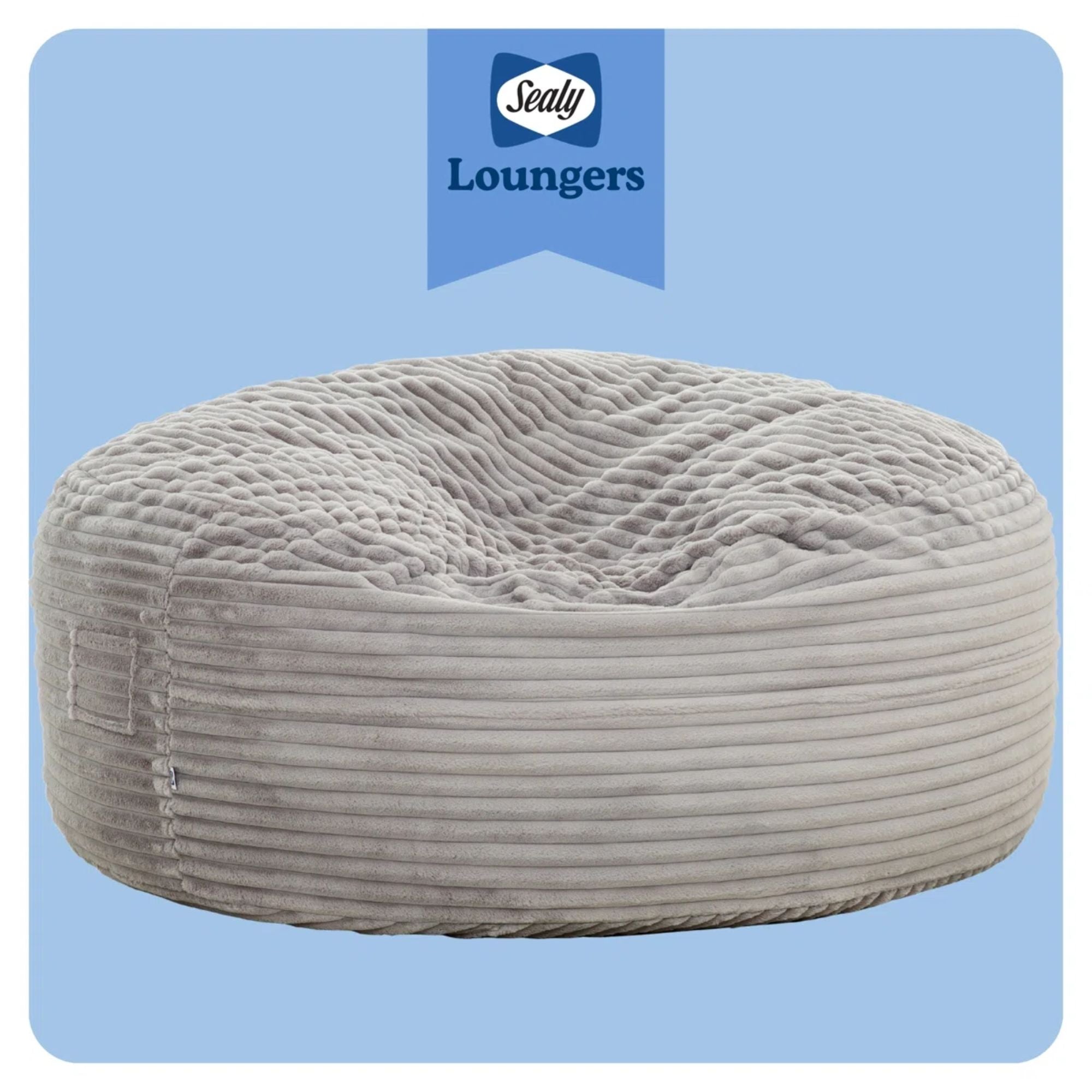 Primo Sealy Kade 6-foot grey bean bag lounger with soft fabric and casual design, perfect for lounging and relaxation.
