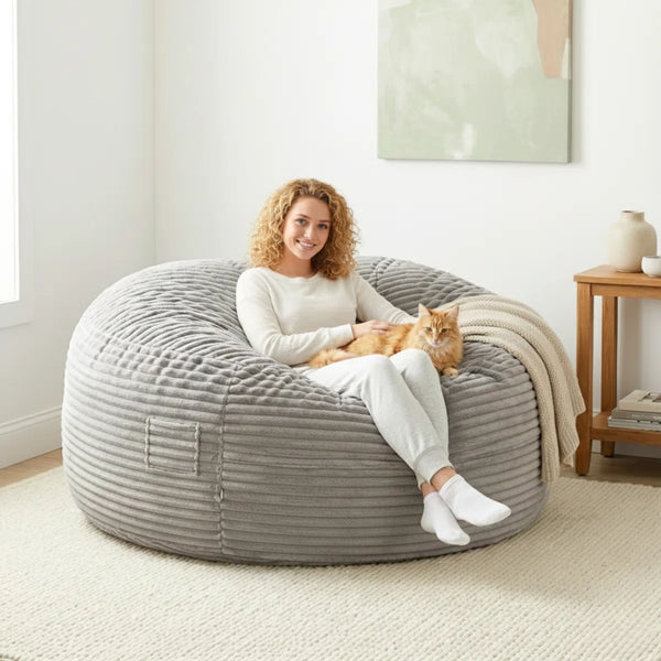 Primo Sealy Kade 6-foot grey bean bag lounger with soft fabric and plush filling, perfect for lounging and relaxation.