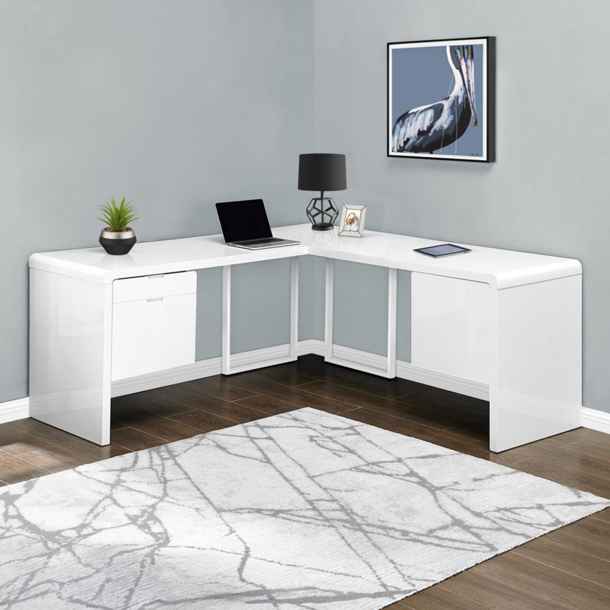 Glossy white L-shape computer desk by Monarch Specialties, featuring a sleek design and ample workspace for home office use.