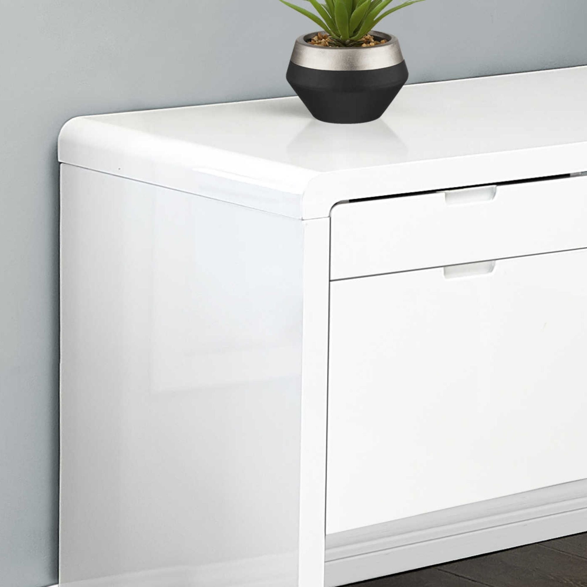 Glossy white 72-inch L-shape computer desk by Monarch Specialties, featuring a modern design and spacious work surface.