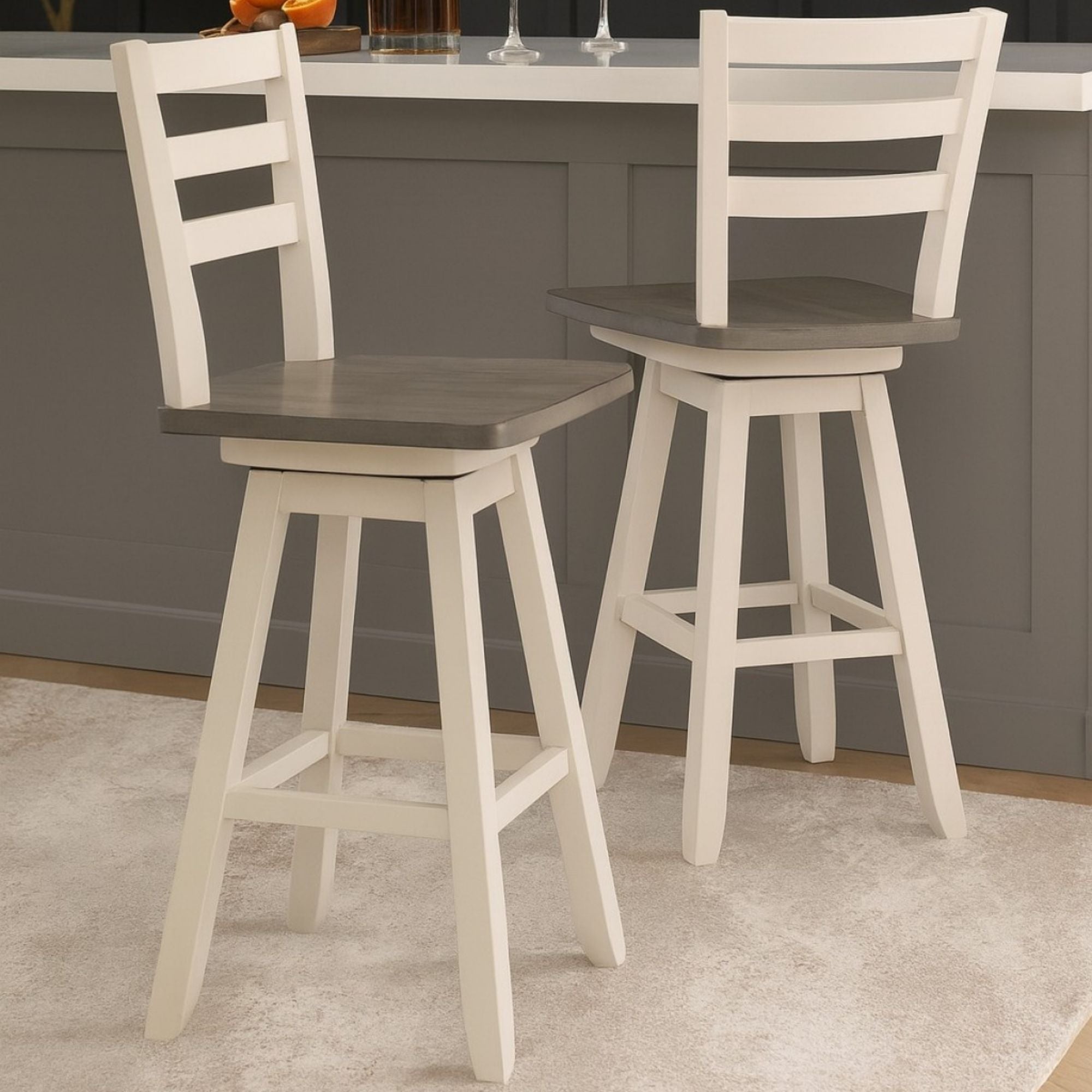 Set of two Brassex counter height swivel bar stools in grey and white with padded seats and backrests.