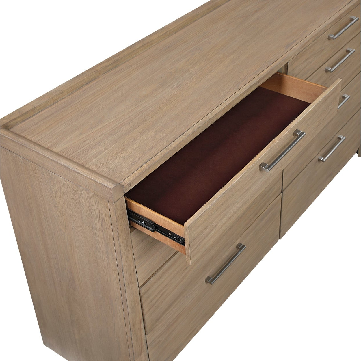 Close-up of the MAZ Riley Collection dresser showing its sleek wood finish and modern drawer handles.