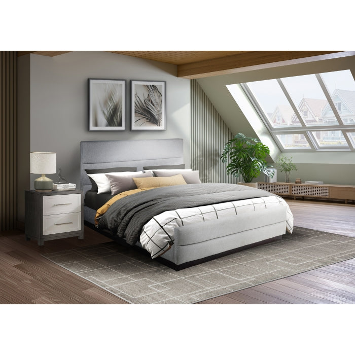 MAZ Calais Collection upholstered bed in light grey fabric with a modern platform design, shown in a stylish bedroom setting.