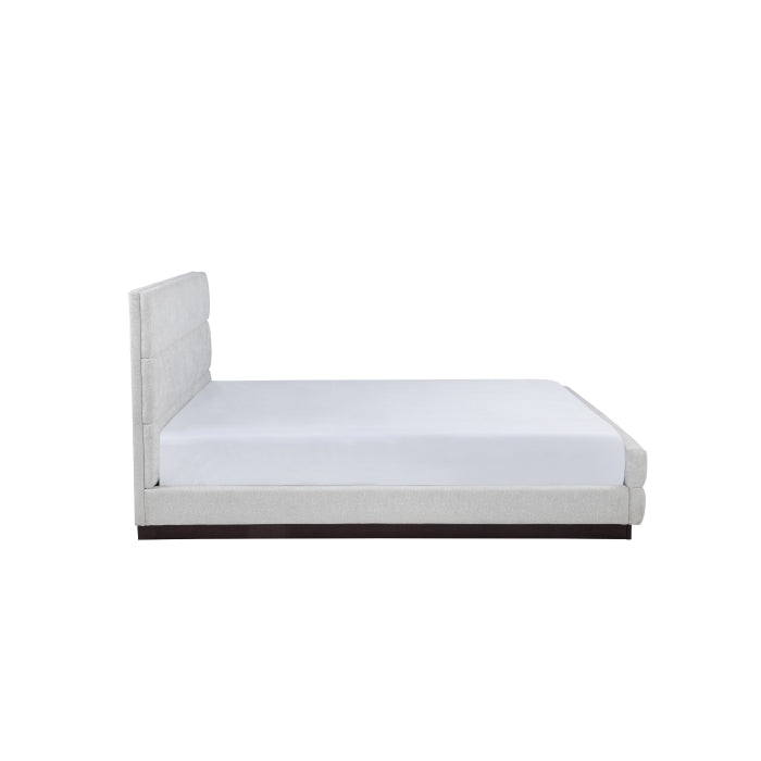 Light grey upholstered Calais Collection bed by MAZ with a modern platform design, shown from the side view.