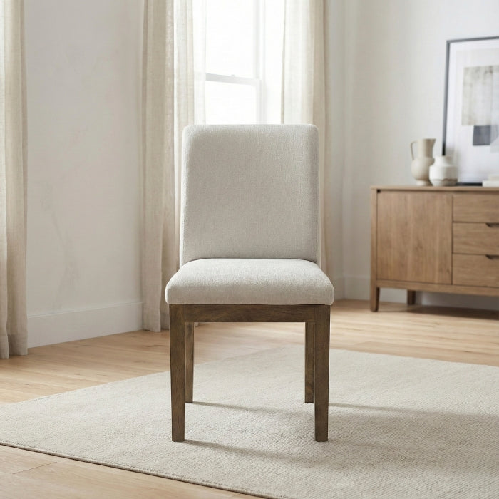 Pair of MAZ Matisse side chairs for kitchen and dining room, featuring modern design with wooden legs and upholstered seats.