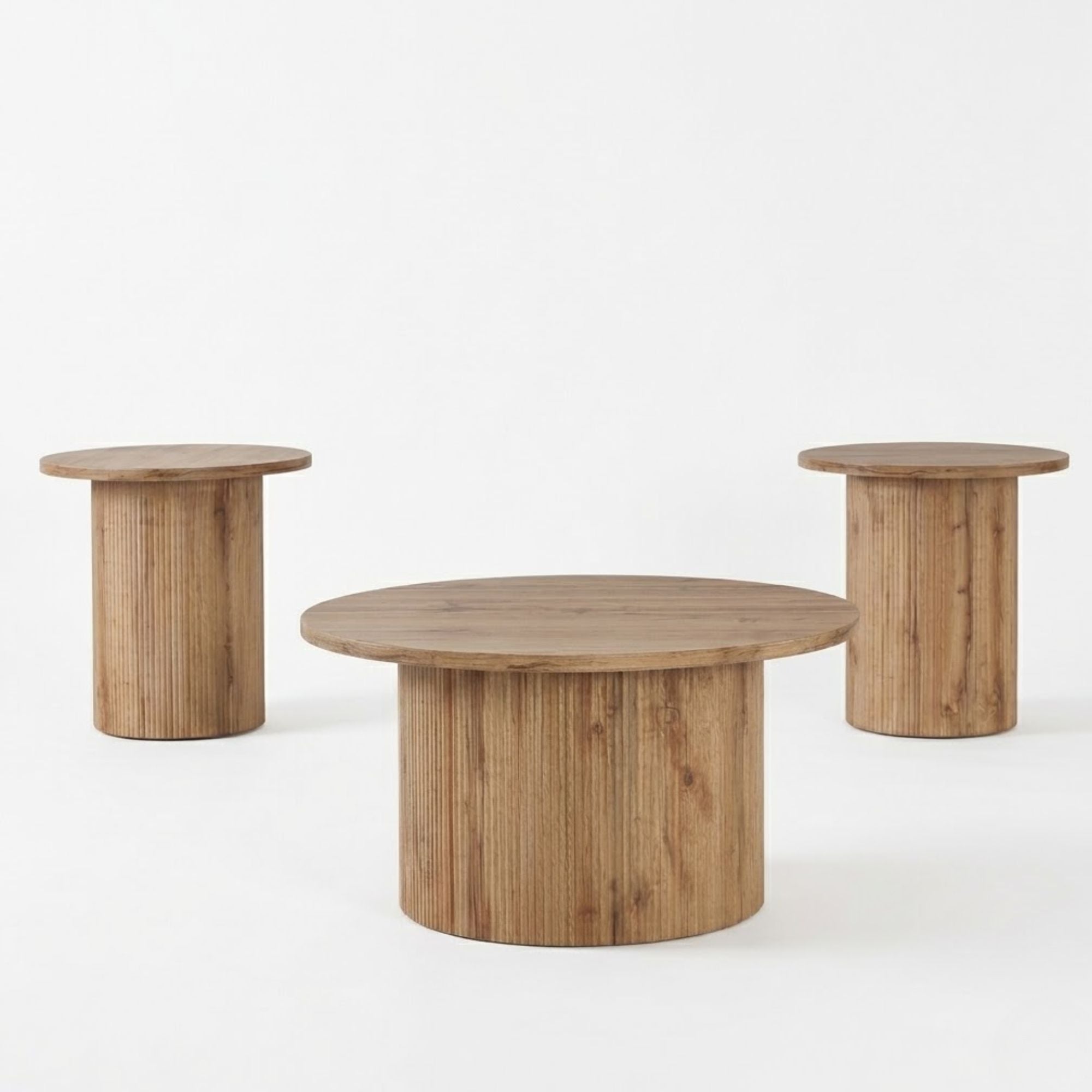 Light natural wood Harper 3-piece coffee table set by IFF with round and rectangular tables arranged together.