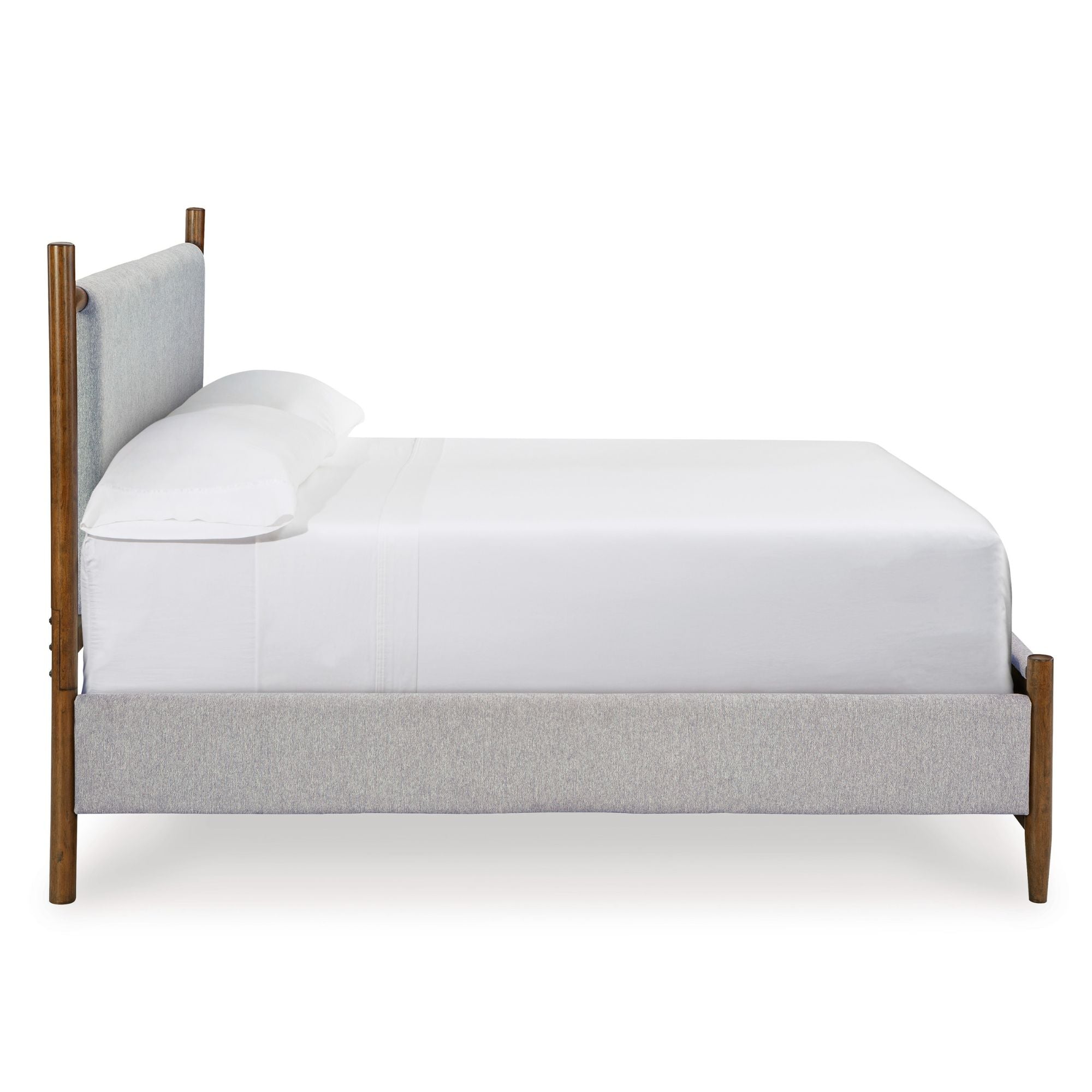 Signature Ashley Lyncott upholstered panel bed with a padded headboard and neutral fabric, showcasing a modern bedroom design.