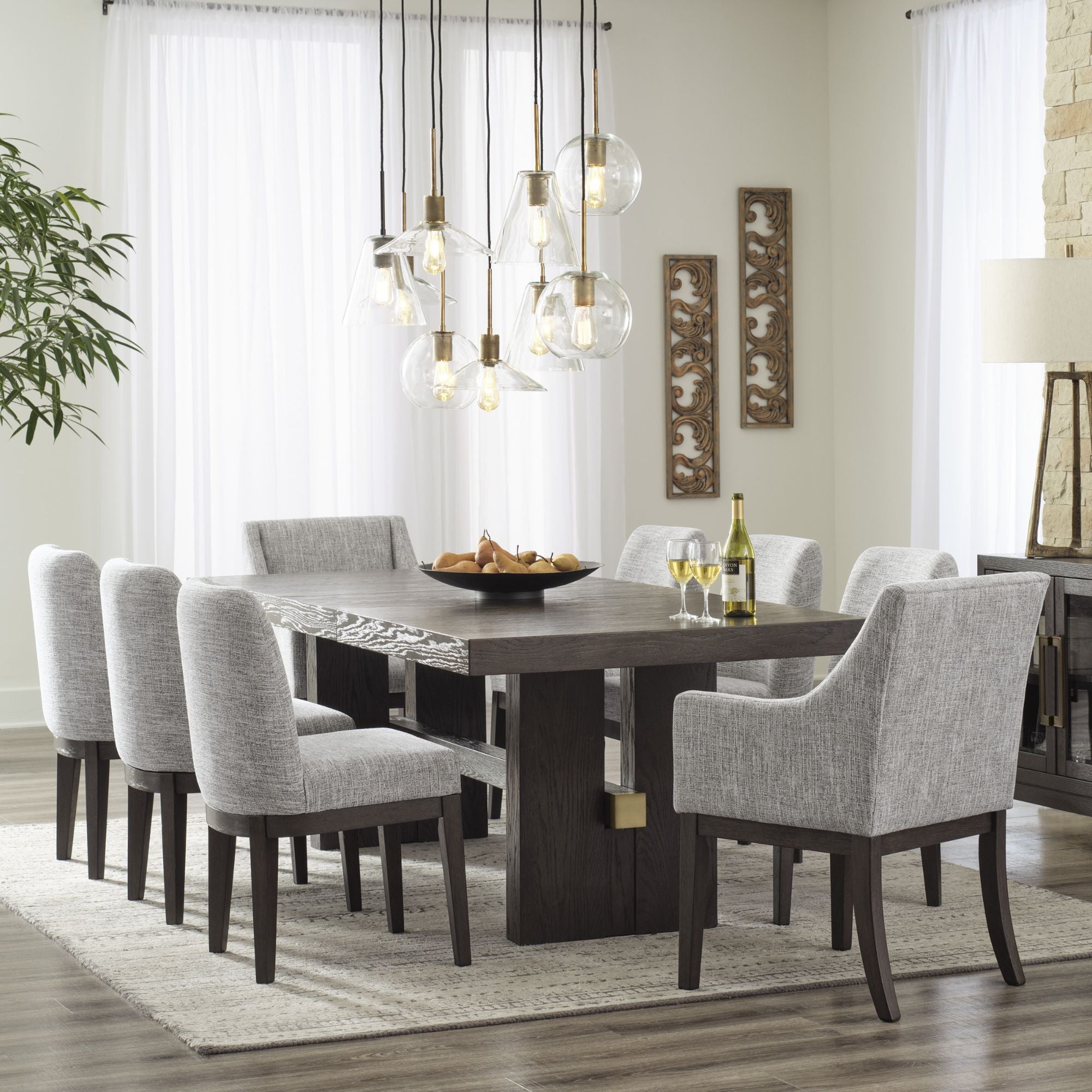 Dark brown Ashley Signature dining room set with extension table and arm chair, showcasing a stylish and modern design.