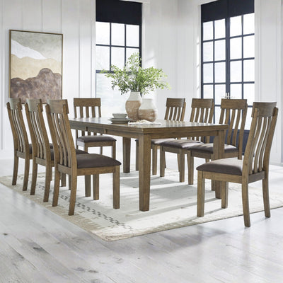 Light brown Ashley Urbinforte 9-piece dining room set with a table and matching chairs in a modern home dining space.