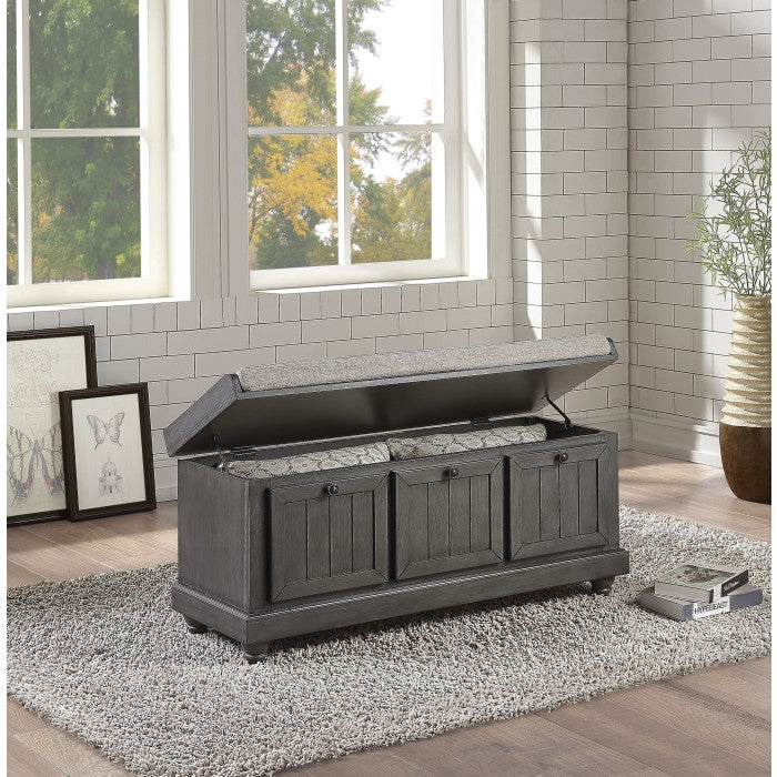 Open grey Woodwell Lift-Top Storage Ottoman Bench by MAZ showing cushioned top and interior storage space.