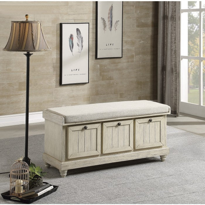 Maz Woodwell Lift-Top Storage Ottoman Bench in beige with cushioned top and wooden legs, offering stylish storage and seating.
