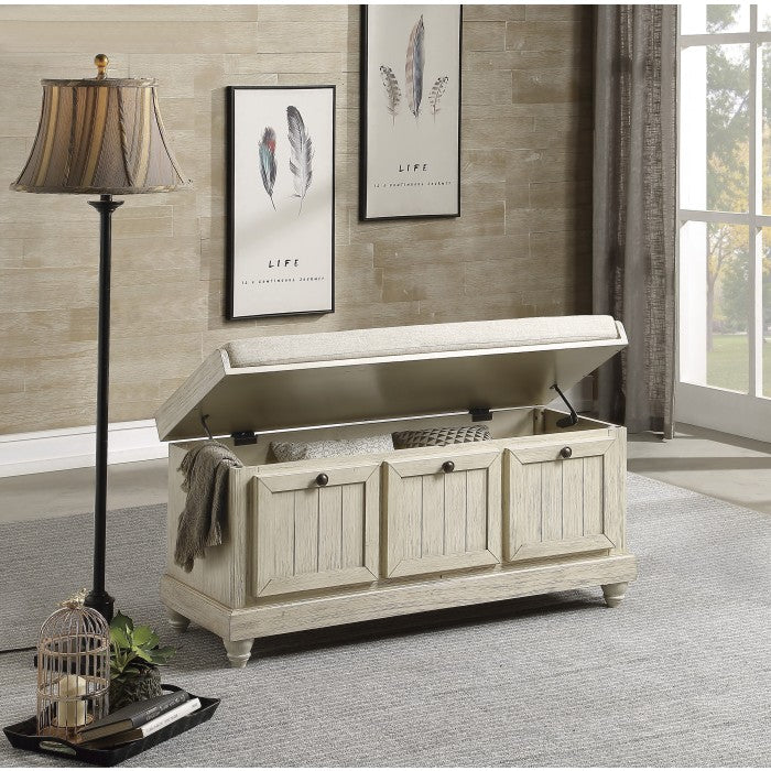 Open beige Woodwell Lift-Top Storage Ottoman Bench by MAZ showing cushioned top and interior storage space.