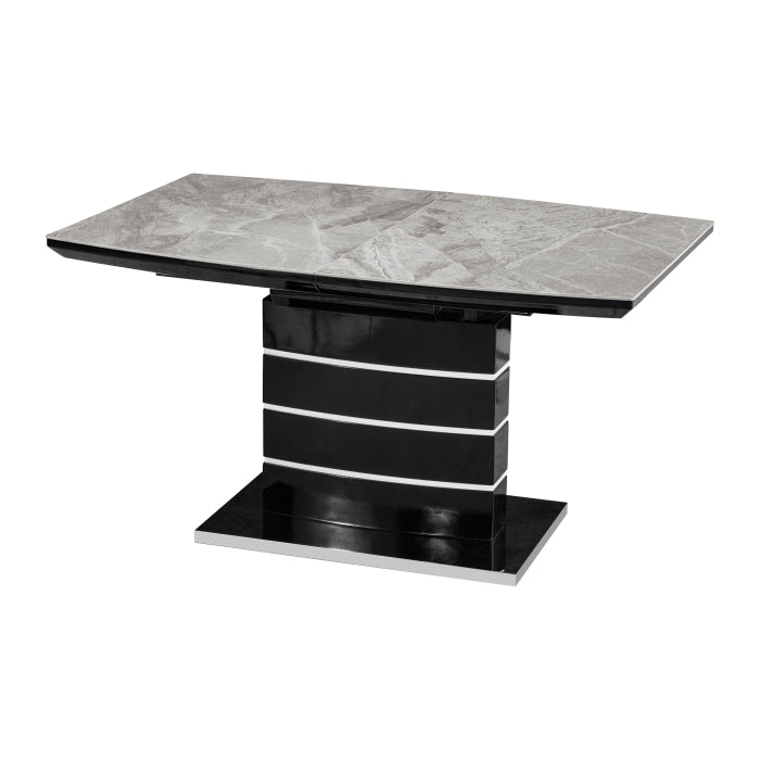 Gray MAZ Glissand Sintered Stone extendable dining table with sleek design and sturdy legs, shown from the side view.