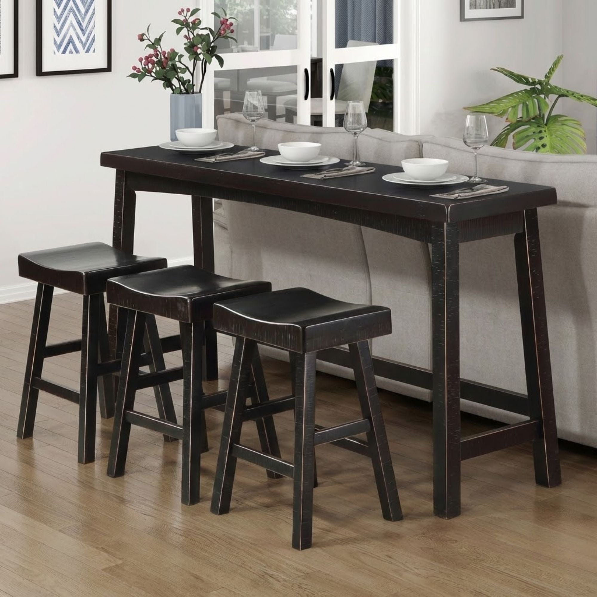 Black MAZ Caspian Collection counter height dining set with four chairs and a table, showcasing a modern design.