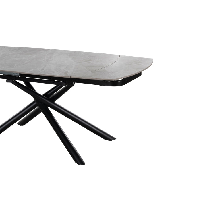 MAZ Crescent Sintered Stone Extending Dining Table with swiveling extension, modern design, smooth surface, and sturdy base.