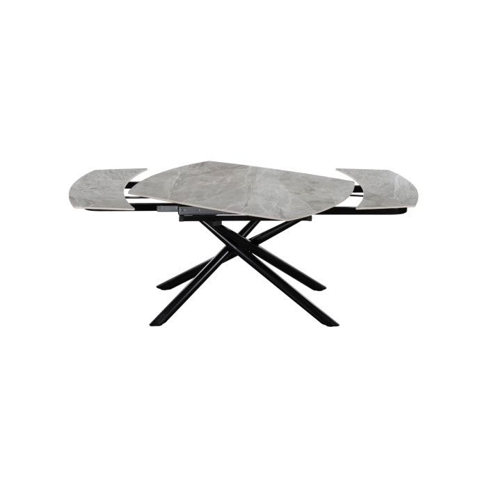 MAZ Crescent Sintered Stone Extending Dining Table with a sleek tabletop and swiveling extension, set in a modern dining room.