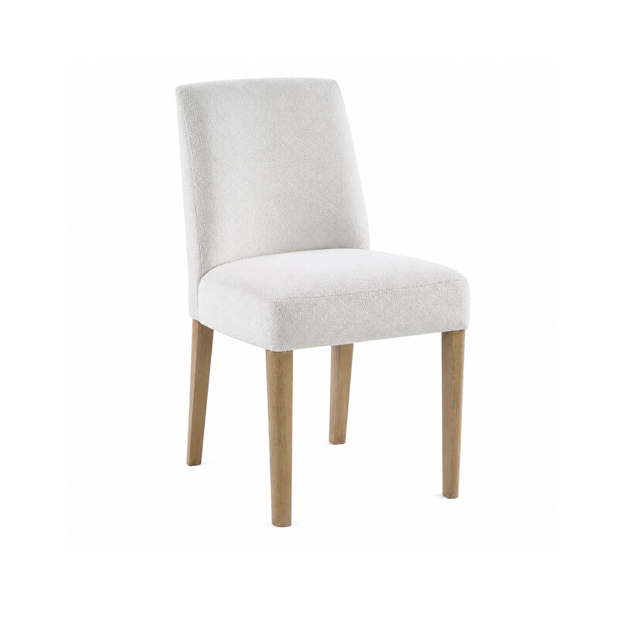 Light grey MAZ Bellwoods dining chair with sleek wooden legs and cushioned seat, ideal for modern dining rooms.
