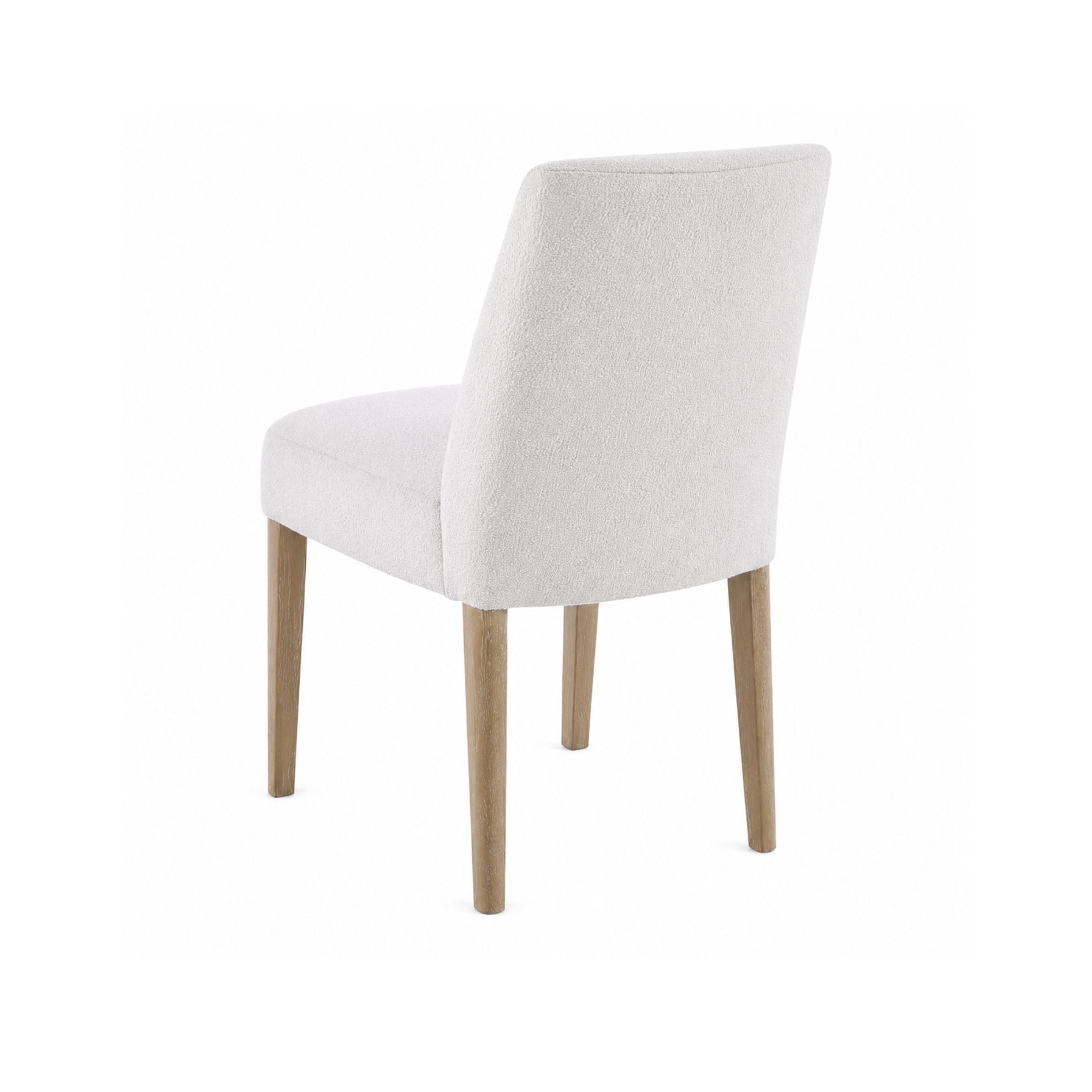 Light grey MAZ Bellwoods dining chair with modern design and wooden legs, shown from a side angle.