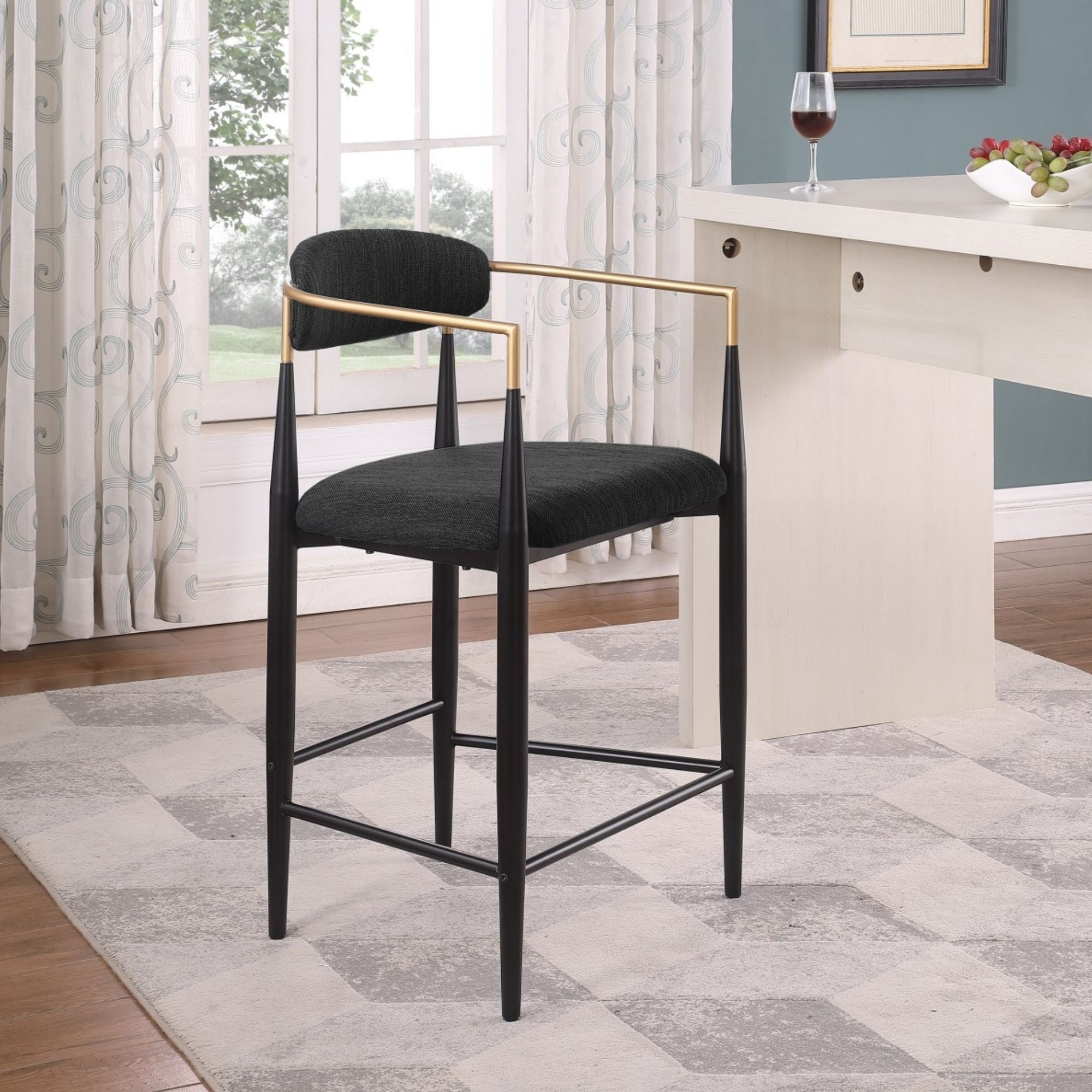Set of two Brassex Mykos black counter bar stools with sleek modern design and sturdy metal legs.