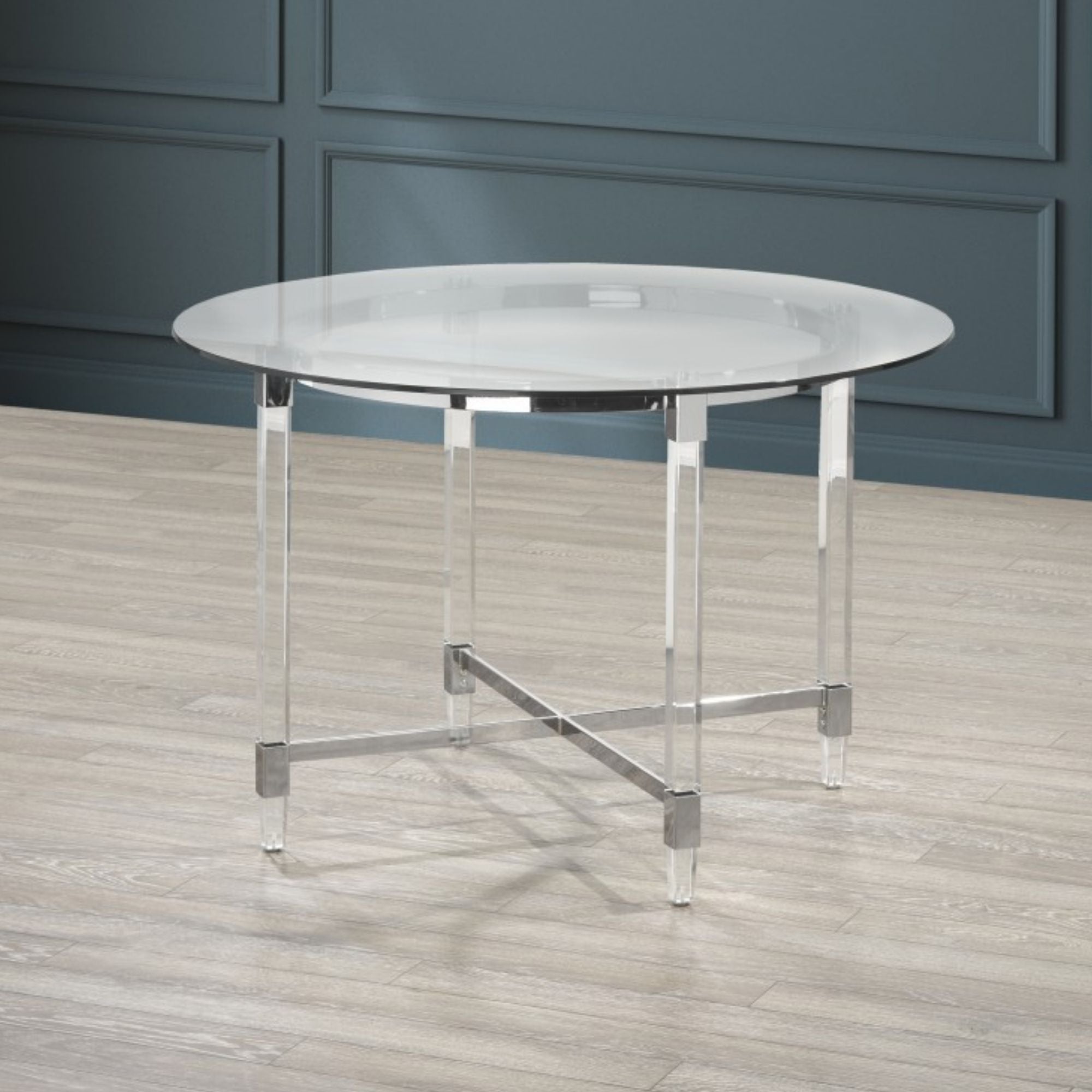 Silver Alaska round dining table by Brassex with a sleek metal finish, perfect for modern dining rooms.