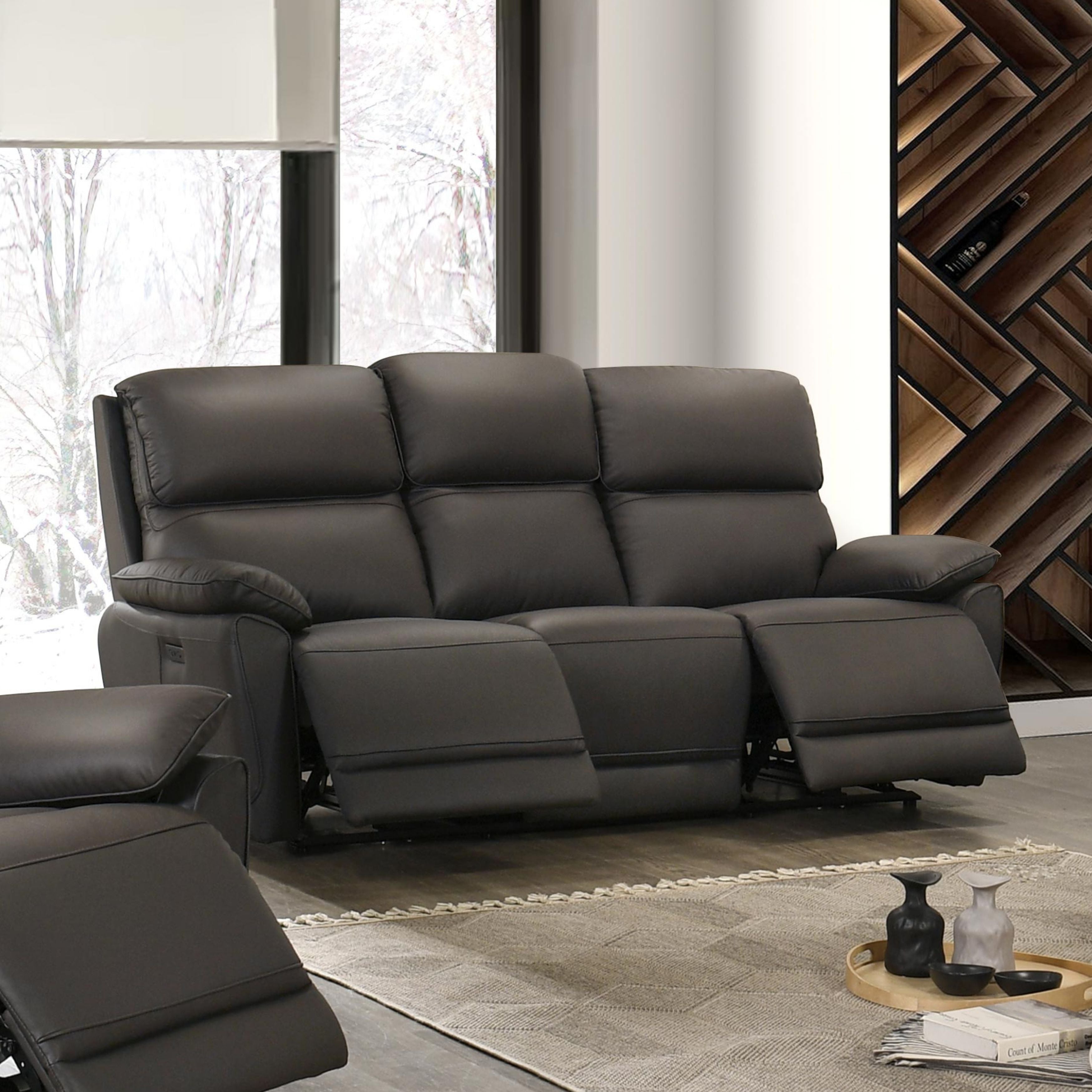 Dark chocolate Grand Luxe leather power recliner sofa by IFF, showcasing plush cushions and reclining feature in a modern living room.