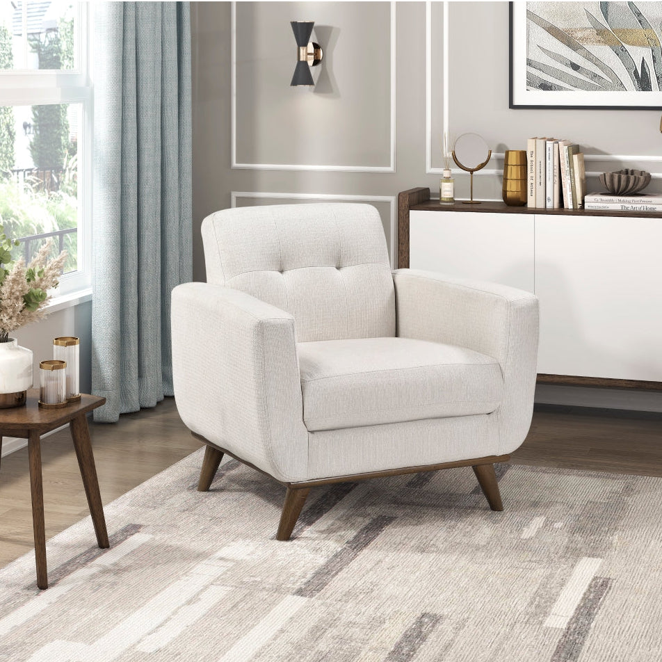 Cream fabric chair from the Martina Collection by M.A.F, featuring a modern sofa design with cushioned seating and stylish upholstery.