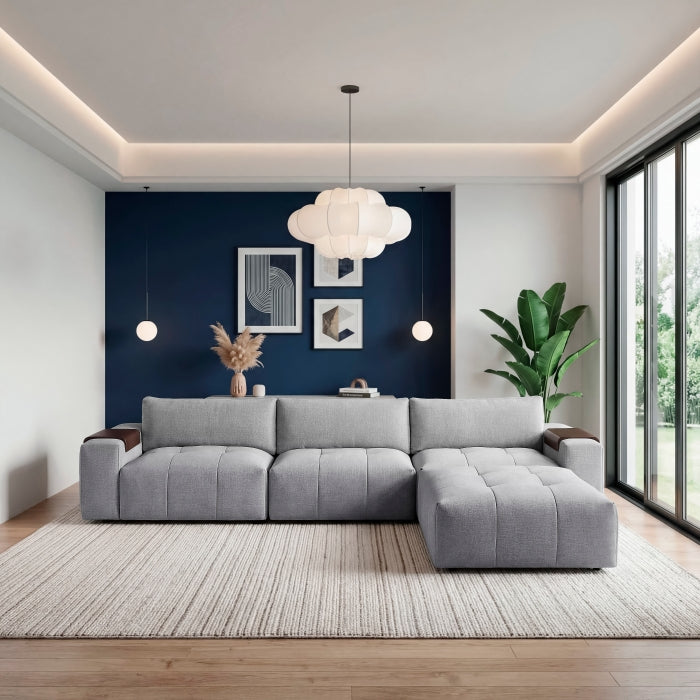 Gray MAZ Tidal 4-piece modular sectional sofa with matching ottoman, showing the front view of the spacious, contemporary living room setup.