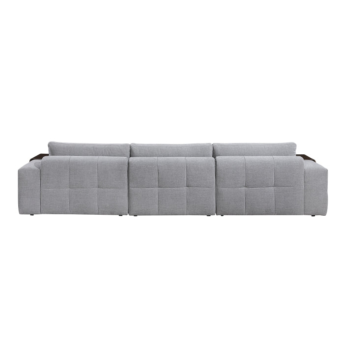 Gray Tidal 4-piece modular sectional sofa with an ottoman by MAZ, showing back view with cushions and fabric texture.