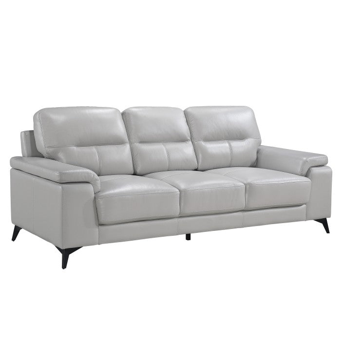 Light grey Mischa leather sofa by MAZ, shown from the side, featuring plush cushions and sleek modern design.