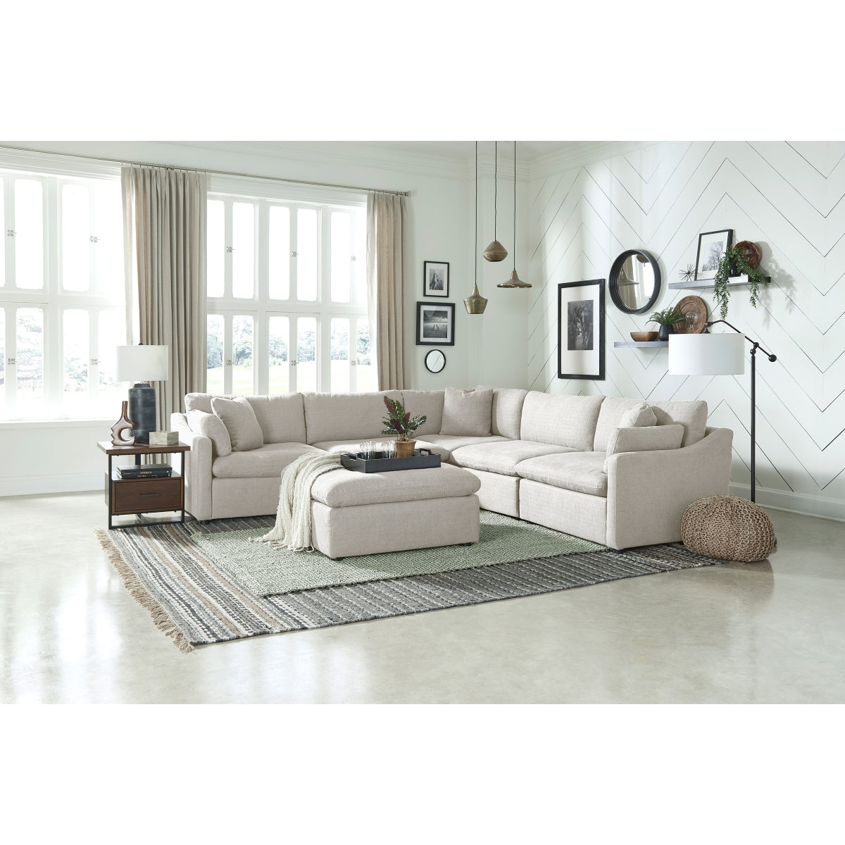 MAZ Howerton Collection 6-piece modular sectional sofa with matching ottoman in a stylish living room setting