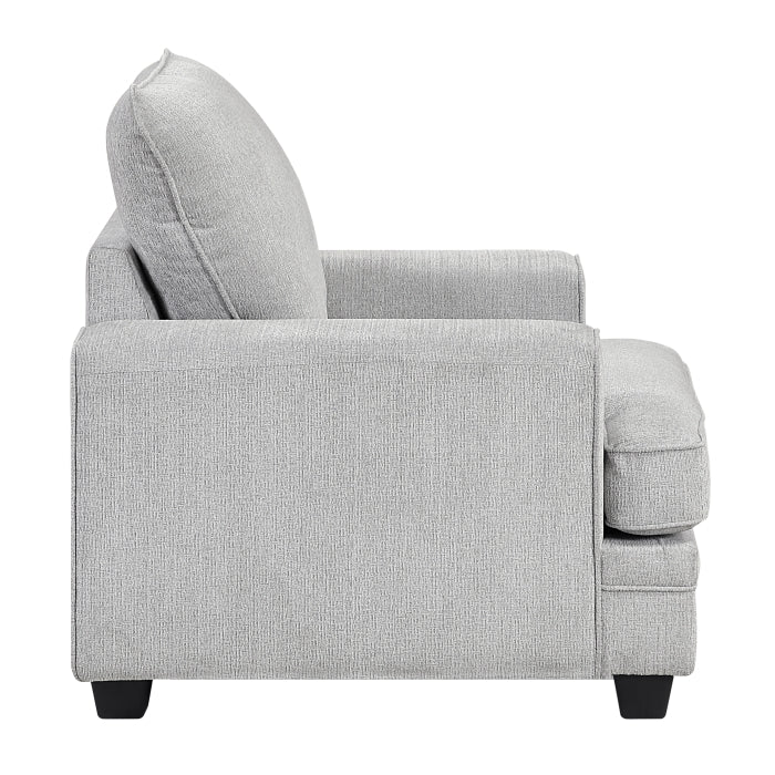 MAZ Sarah Accent Chair shown from the side with neutral fabric upholstery and wooden legs, stylish addition to living room decor.