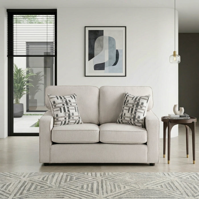 Cream-colored MAZ Frances Collection loveseat with plush cushions and modern design, shown from the front.