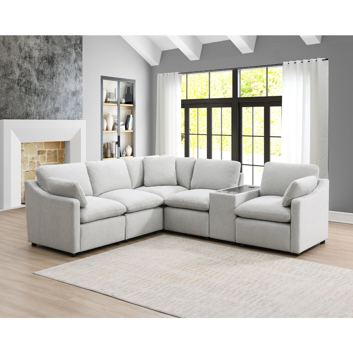 Light grey MAZ Pippa Collection 6-piece modular sectional sofa with plush cushions and modern design in a stylish living room setting.
